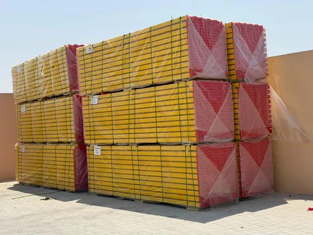 Packs of H20 timber beams strapped and wrapped for transport